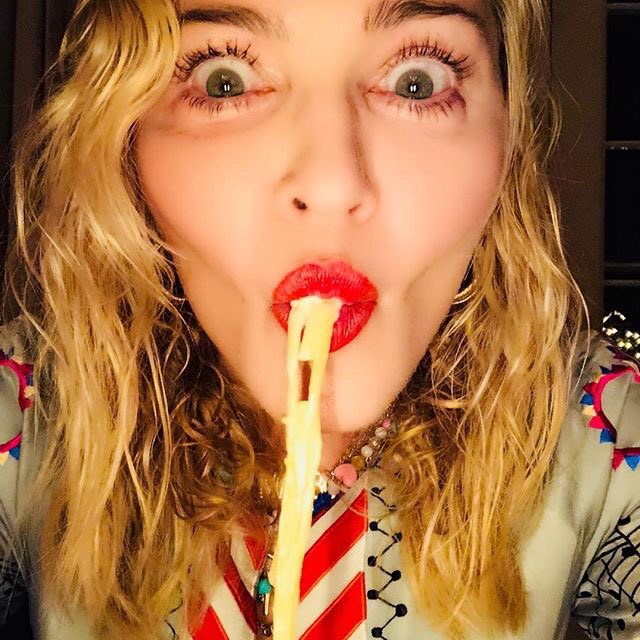 Madonna eating pasta