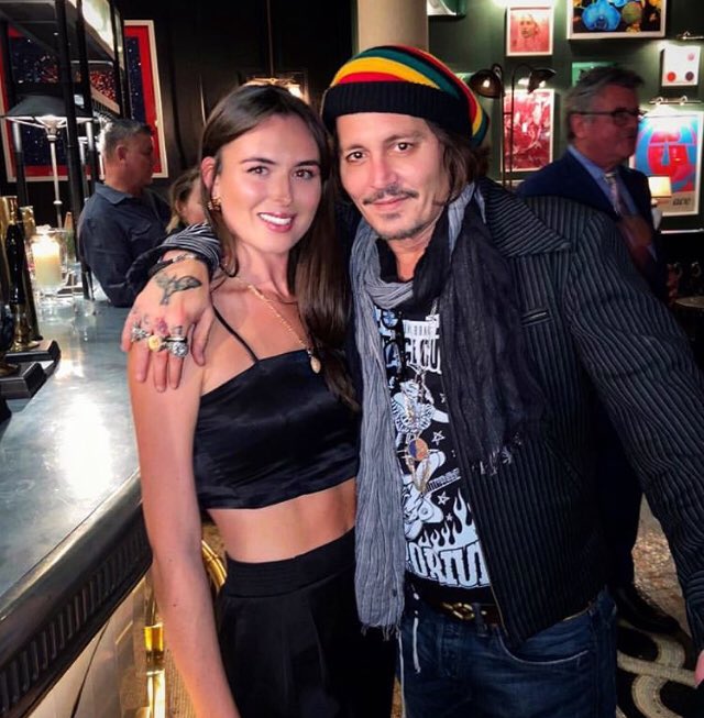 Depp with fan in London pub