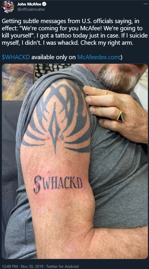John McAfee $WHACKED tattoo