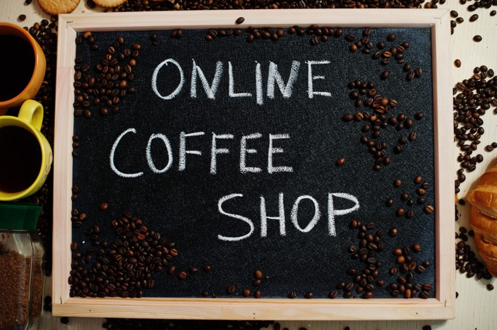 Online coffee shop. Words on blackboard flat lay.