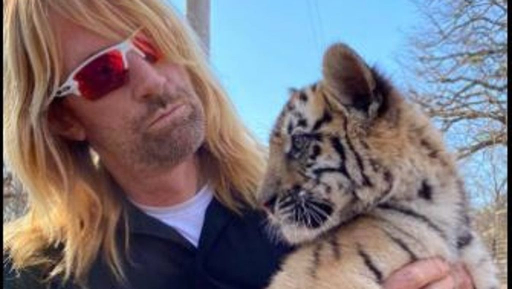 Old friend now Joe Exotic enemy, Erik Cowie with tiger cub