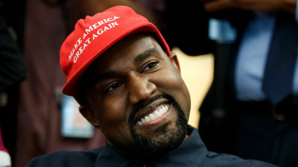 Kanye West in a MAGA cap.