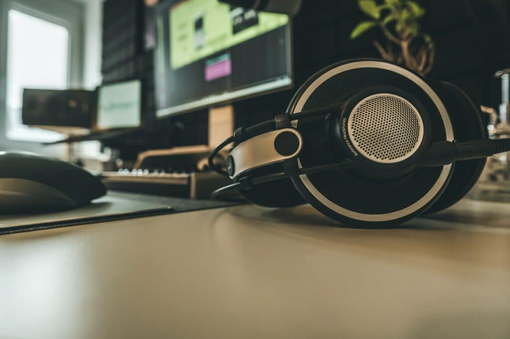 Headphones in recording studio in front of opened DAW