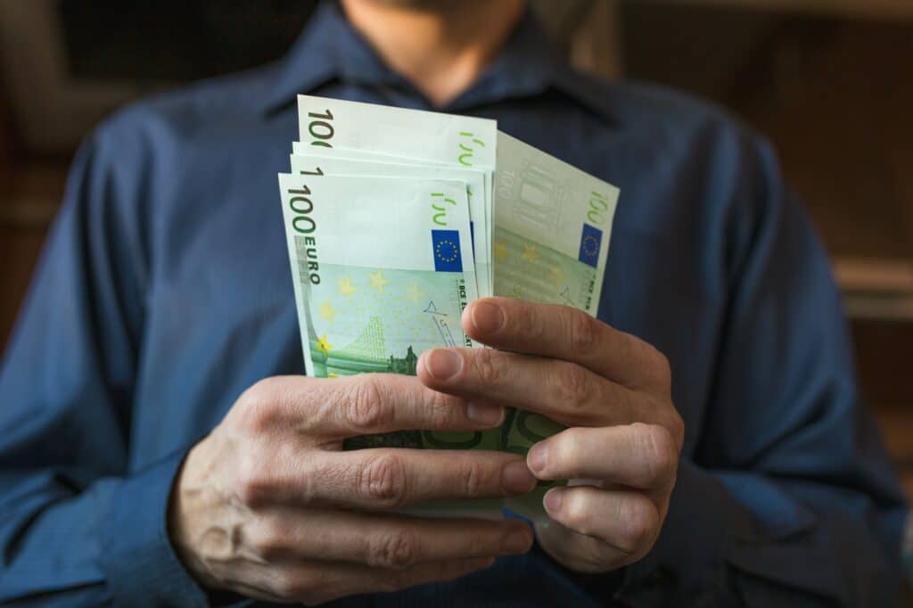 Men's hands count Euro bills cash money