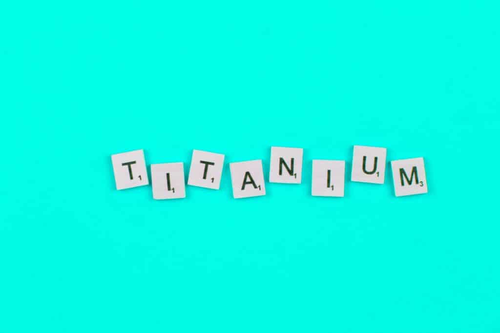 Titanium scrabble letters word on blue