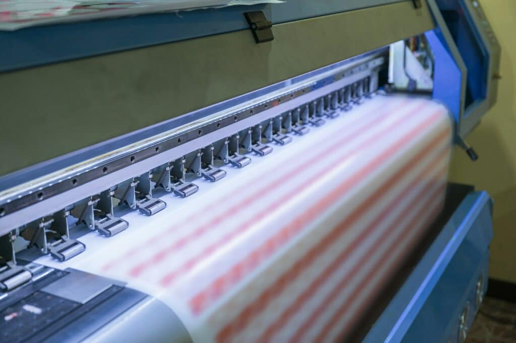 Large format inkjet printer working on sticker sheets