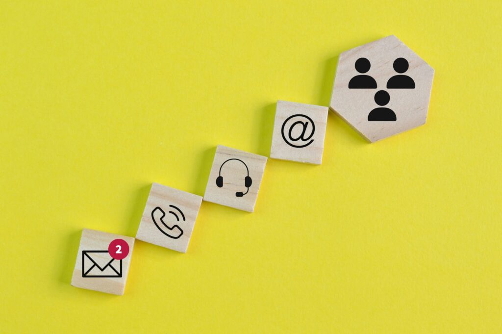 Wooden block with customer service and technical support symbols