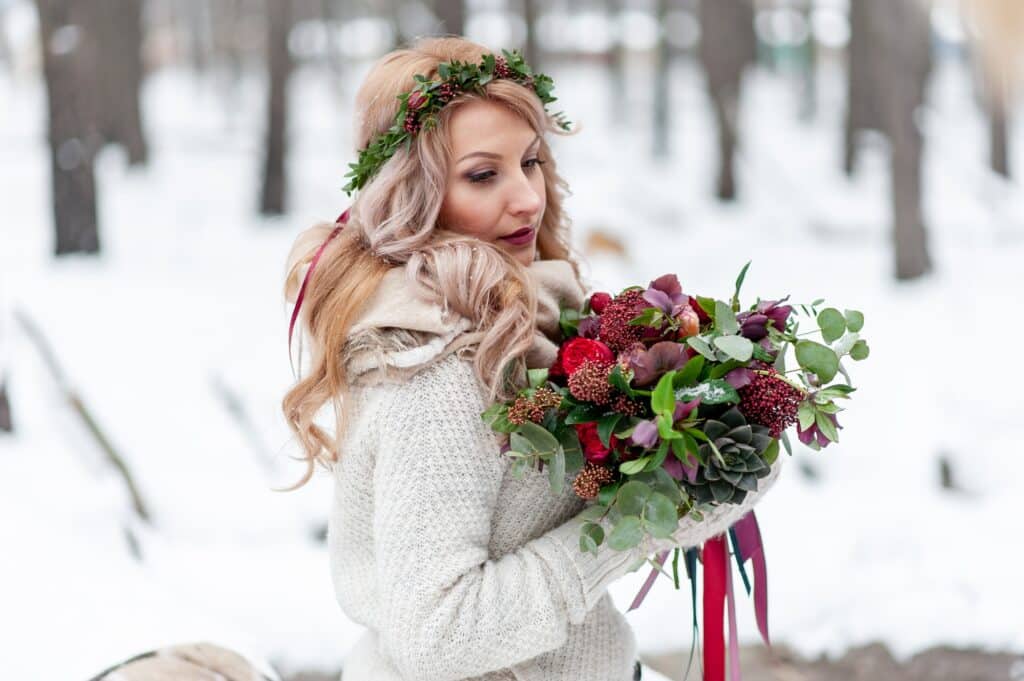 A young girl of Slavic appearance with a wreath of wildflowers.